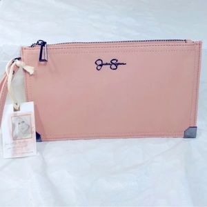 Jessica Simpson clutch pink in color can holds lip balm,cellphone,keys,and etc